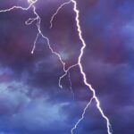 A lightning bolt lights up the sky.