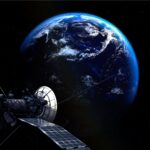 A satellite orbits around the Earth in this moody shot.