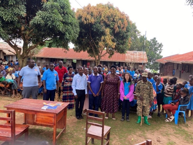 Figure 2. Zhang and the team with the teachers and children at the St. Victor Mulabana Primary School