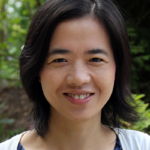 Li Li's headshot, depicting her smiling in front of a green backdrop