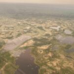 Permafrost thaw bogs in the Northwest Territories, Canada. A nearby fire caused haze in the scene. Photos were taken from a helicopter.