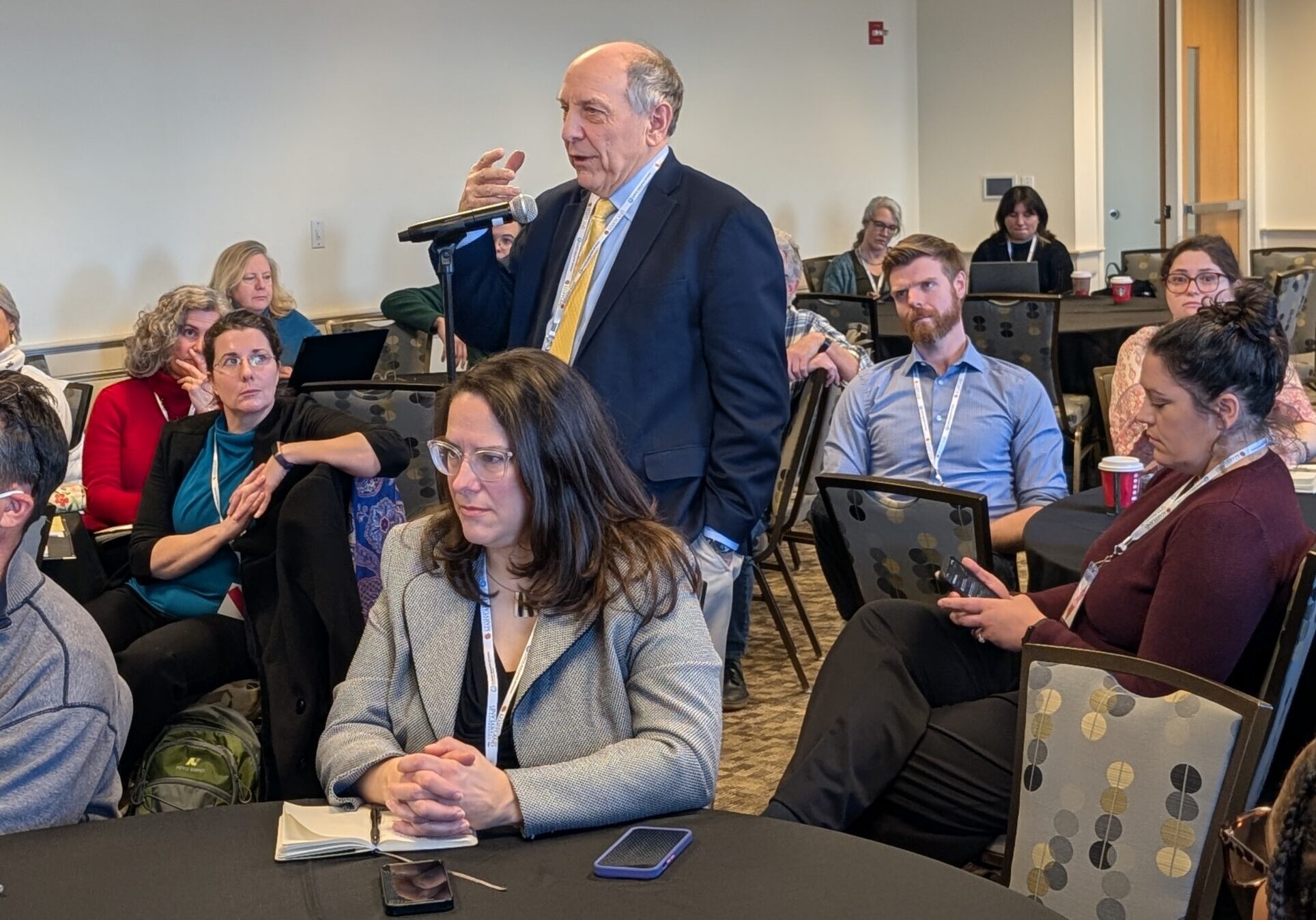 Louis Uccellini poses a question to the panel.  Photo by Cazzy Medley.