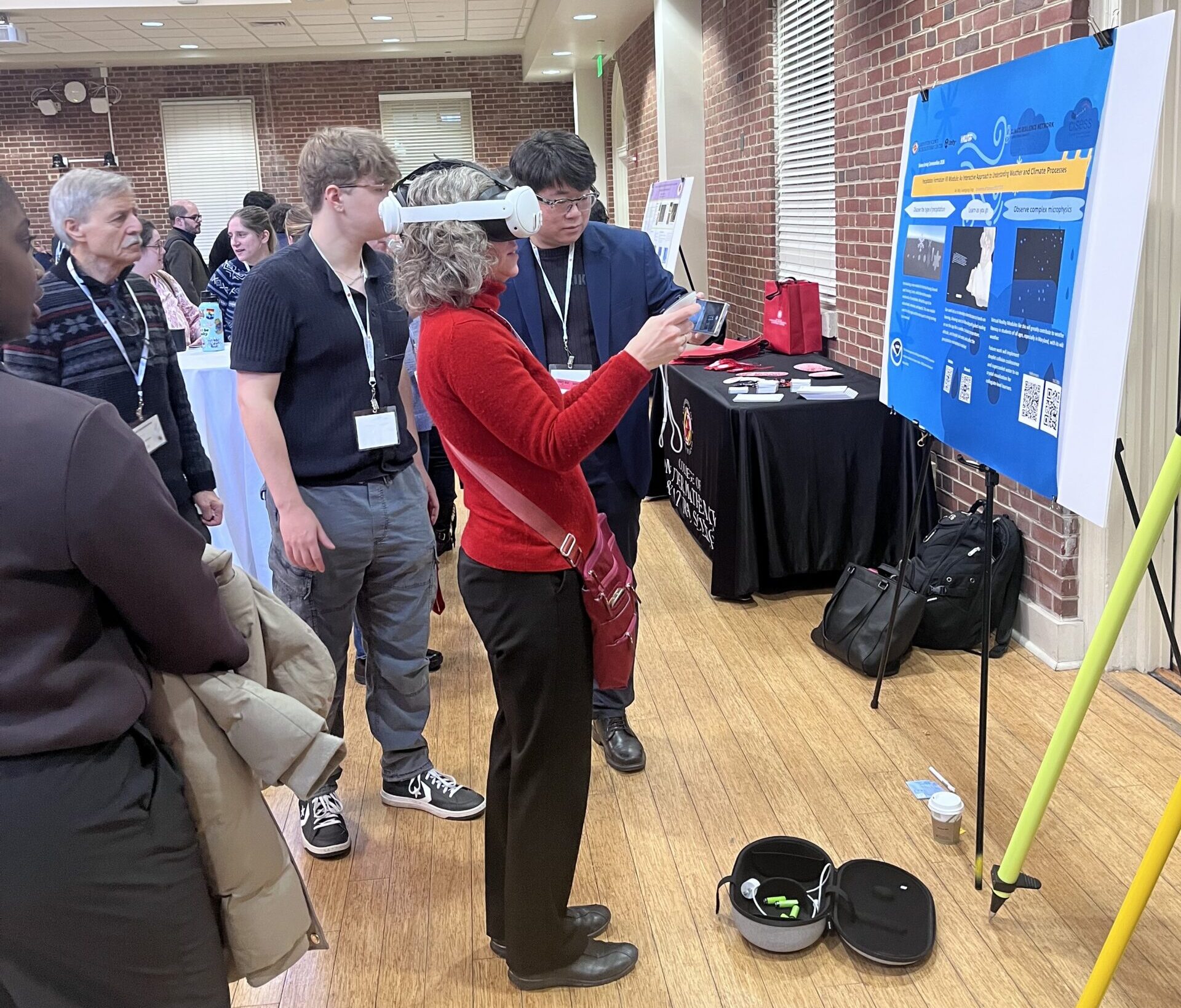 Ariana Sutton-Grier uses the VR setup with Ian Way and Guangyang Fang. Photo by Kate Cooney.