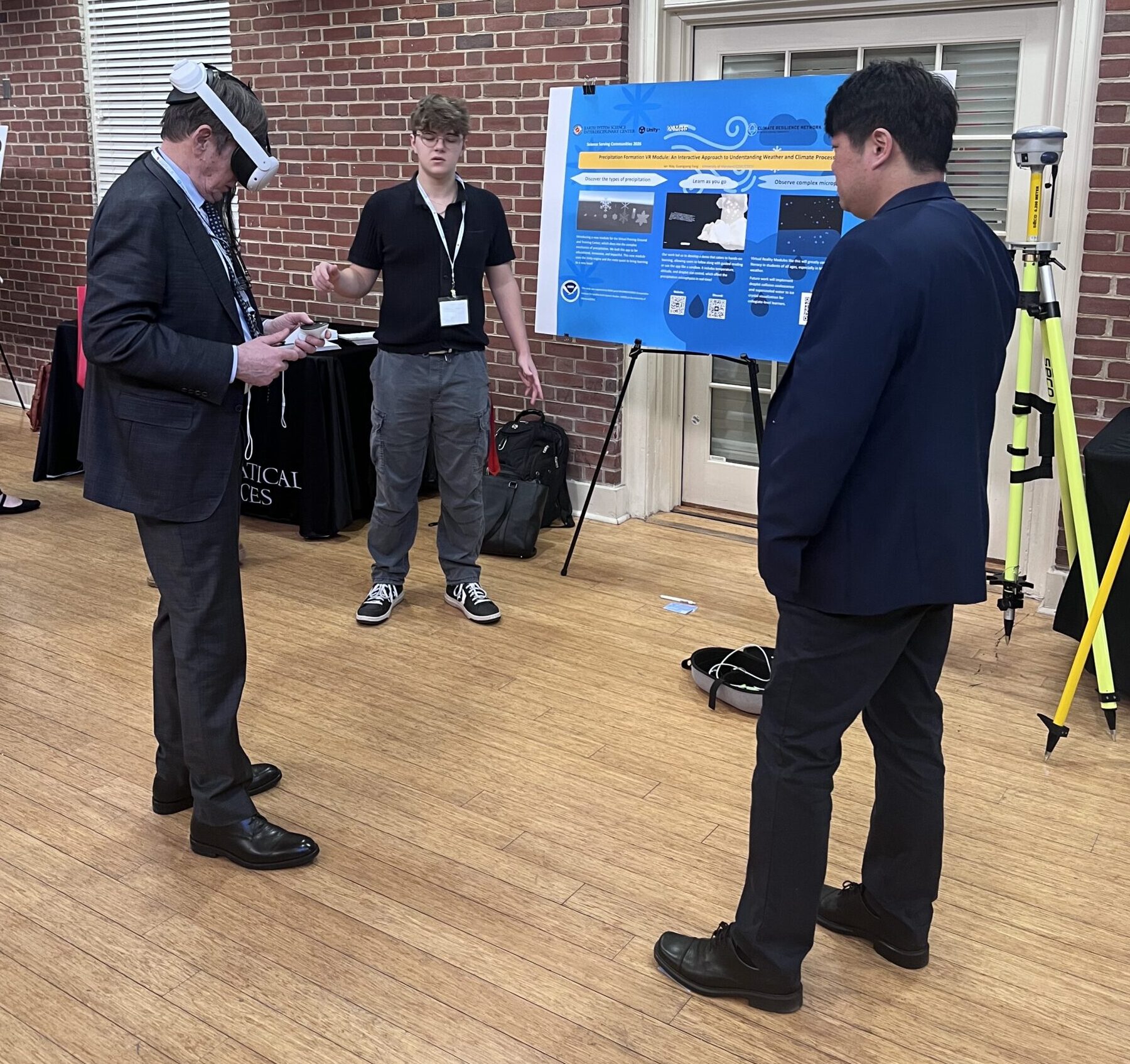 Lars Peter Riishojgaard tries the VR activity with Ian Way and Guangyang Fang. Photo by Kate Cooney.